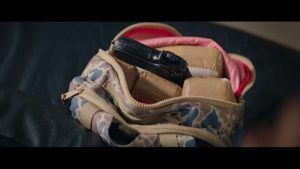 Ecstasy and a loaded gun in Malcolm's backpack.